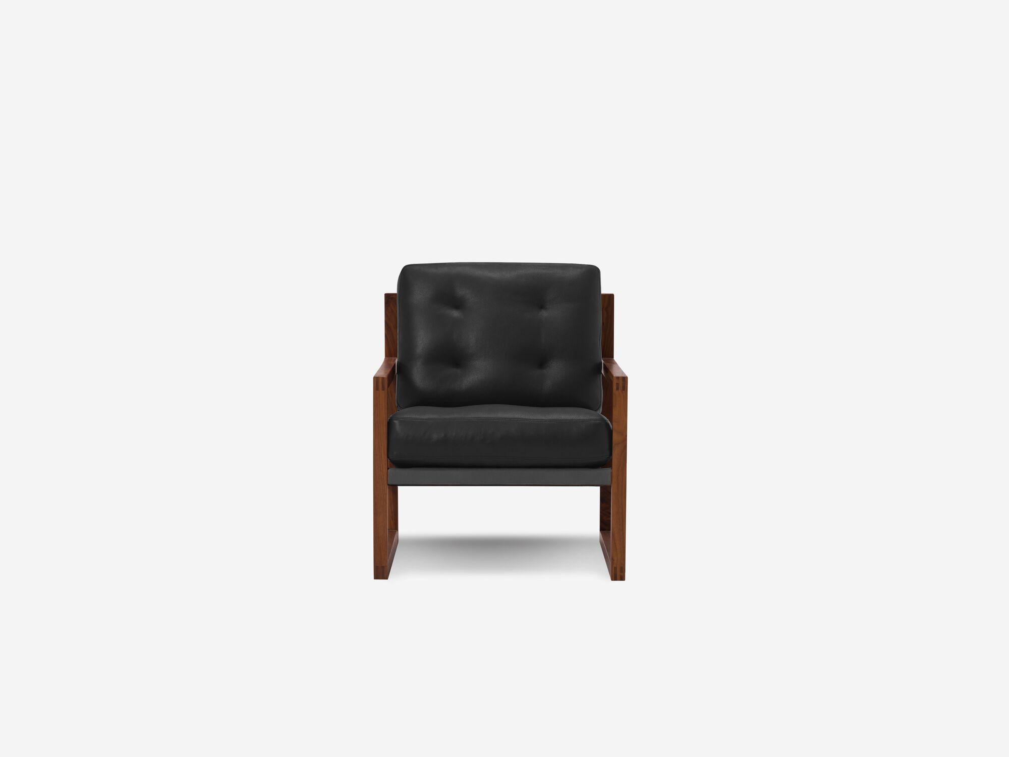 Front view of black and walnut tufted lounge chair